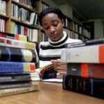 University student studying in library.